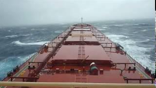 Bulk Carrier Ship Passing In Storm In Atlantic Ocean