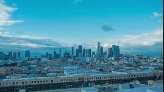 time lapse in motion of downtown los angeles skyline with clouds and skyscrapers