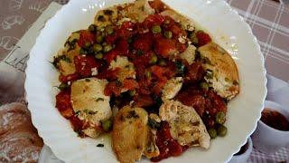 Stewed chicken breast with tomatoes and green peas. Fast and delicious