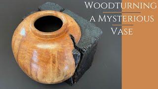 woodturning a mysterious vase in a cube of burnt oak