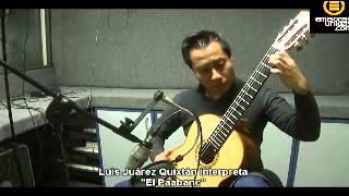 Luis Juárez Quixtán interpreta con su guitarra "El Paabanc"