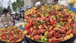 A Handsome Chinese Guy Cook Chicken Leg Potato Noodles Food for the old on the Street in a Village