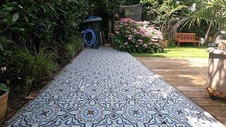 Nicole's turning old concrete gravel pavers into a great Portuguese patio