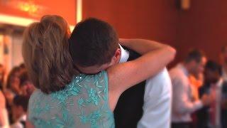 Groom Cries in His Mother's Arms at Wedding