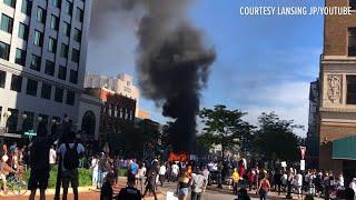 Cars overturned, fires set after day of protests in Lansing