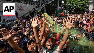 People in Bangladesh celebrate after Prime Minister Sheikh Hasina resigns