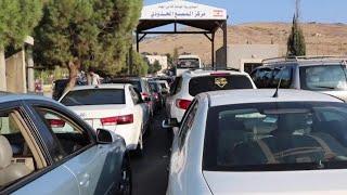 People fleeing Israeli strikes flock to Lebanon-Syria border crossing | AFP