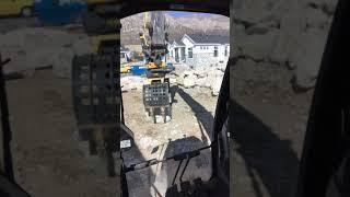 How To Set a Rock Wall using a Engcon Grapple on a Deere 250G Excavator