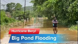 Man wades through Big Pond flood waters