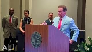 Nick Saban and Miss Terry speak after the resolution to name the field 'Saban Field' is finalized