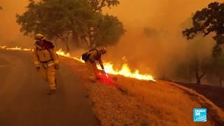 Firefighters struggle to contain destructive wildfire in Northern California