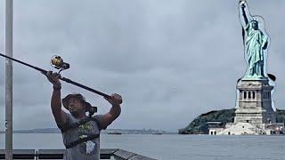 Urban Fishing in the Fog by the Statue of Liberty in NYC