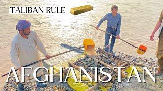 Afghan gold prospectors on the Panj river in Tajikistan