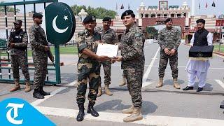 India's BSF, Pakistan Rangers exchange sweets at Attari-Wagah border in Amritsar on Eid-al-Adha