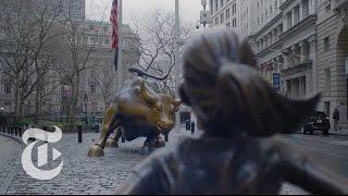 Statue of Courageous Girl Faces Wall Street Bull | The New York Times