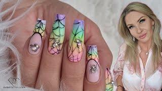 French ombre nails. Beautiful Halloween nails with rainbow ombre and crystals spiders 