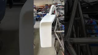 Camburg Racing race truck getting a new fiberglass body mounted.