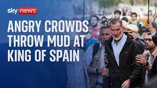 Angry crowds hurl mud and insults at King of Spain as he visits town devastated by floods