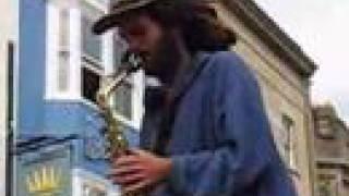 Saxophone and Hang on GlastonburyMarket cross