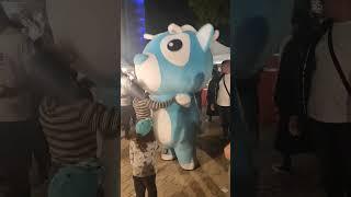 Girl dancing with mascot