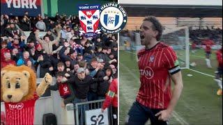 AWESOME ANGLE ON PLAYERS AND FANS CELEBRATING YORK’S LAST-DITCH GOAL