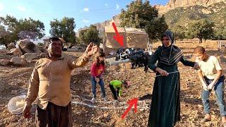 New plan: Akram beside Naseroo prepares the plan of the stable for the goats