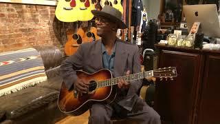 Eric Bibb in NYC with Preston Thompson receiving his 000 12 Fret Brazilian Sunburst