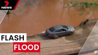 Flash flooding in north-west Queensland disrupting new year plans | 7NEWS