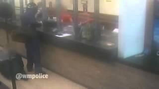 [VIDEO] Chilling moment bank robber held customer at knifepoint