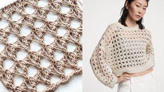 The intricate large mesh of the Mesh cardigan by Cucinelli 