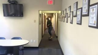 Producer Kira Buxton longboards through the NJ1015 halls