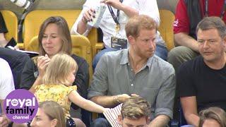 Sneaky toddler steals Prince Harry's popcorn