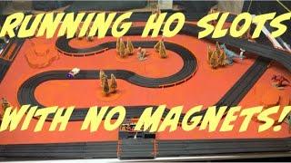 Racing HO slot cars without magnets