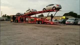 Miller Titan 7 car trailer getting unloaded