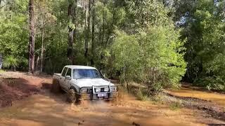 Supercharged 1UZFE V8 Hilux blasting a mud hole!