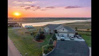 Home for sale with gorgeous views of the city and Little Muddy River in Williston, ND!