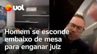 Advogado e cliente tentam enganar juiz e homem se esconde embaixo de mesa em audiência; veja vídeo