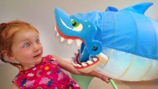 DON'T GET CAUGHT!! Adley reviews Shark Bite pool toy with Mom (mystery guest)