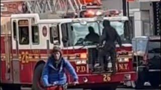 **CRAZY MAN JUMPS ON FDNY LADDER** & spits on officer - Engine 91 & Ladder 26 Respond to Harlem Fire