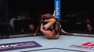 Niko Price holds opponent's head with left foot then proceeds to knock him out on his back.