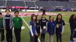 The Cast of Matilda the Musical sing the National Anthem at a Giants Game