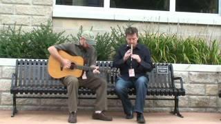 Larry Nugent and Patsy O'Brien perform on Floyd's Bench in Muskegon, MI.