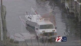 People preparing for Sandy at the Greenwich Bay Marina