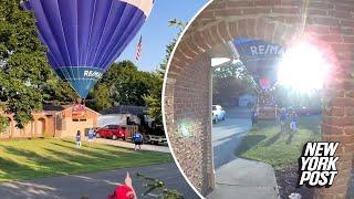 Hot air balloon narrowly misses roof, lands in Ohio neighborhood