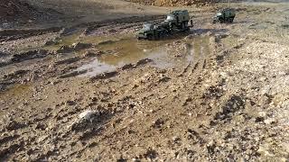 URAL 4320 with full loading Flatbed Trailer and URAL Radio Box in a Mud and Water Crossing Sequence