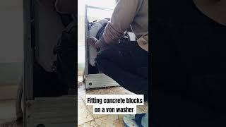 Fitting concrete blocks on a von washing machine/von appliances repair Nairobi #von #washer