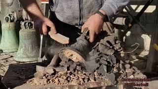 The newly cast bell is released from the mold. Pontificia Fonderia di Campane Marinelli Agnone