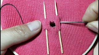 An interesting way to decoratively darn holes in clothes