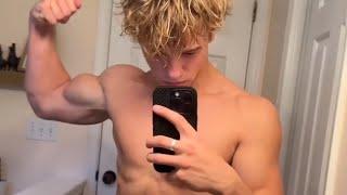 16 years old teen boy flexing muscles