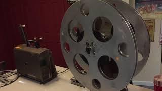 Eiki long play unit. Works best with any top loading projector. Runs up to 2 1/2 hours of 16mm film.